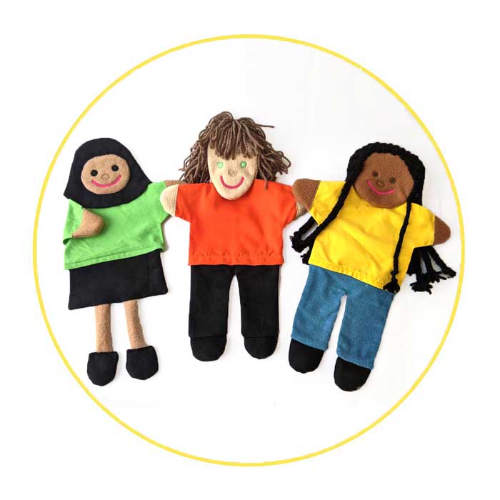 Build a Puppet- The glove puppet on the left wears a green top and hijab. The middle puppet wears an orange top and the the puppet on the right wears a yellow top and jeans.