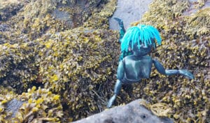 Custom marionette; bespoke string puppet of a mermaid on a seaweed background