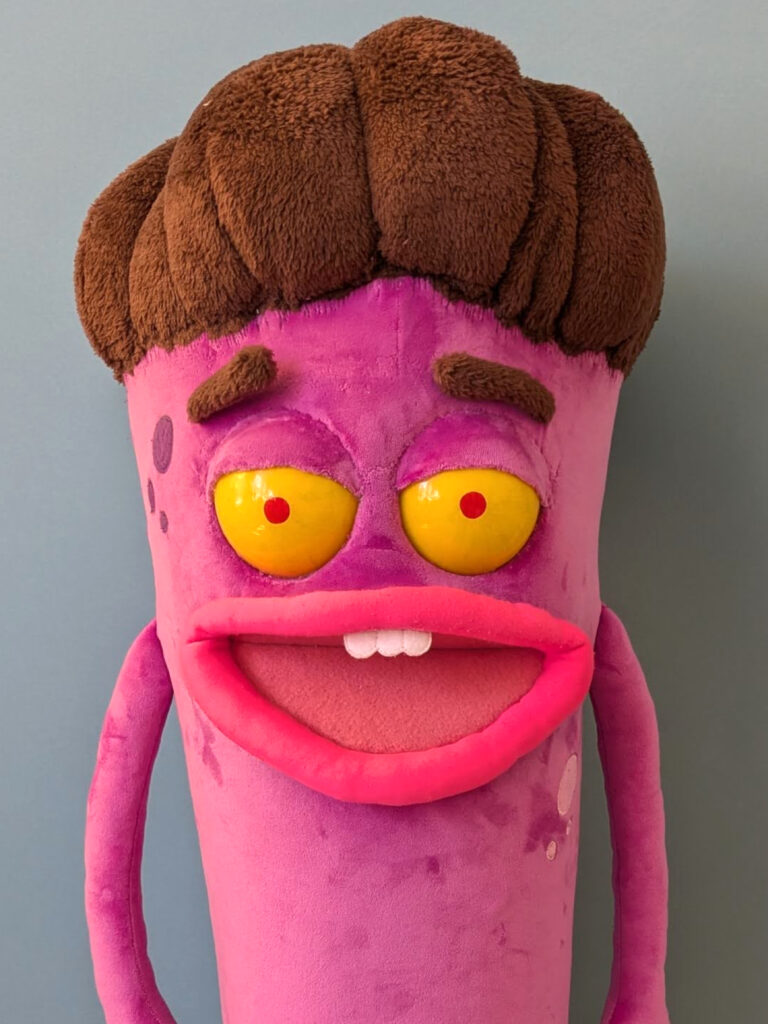 pink sausage A puppet with moving eyebrows